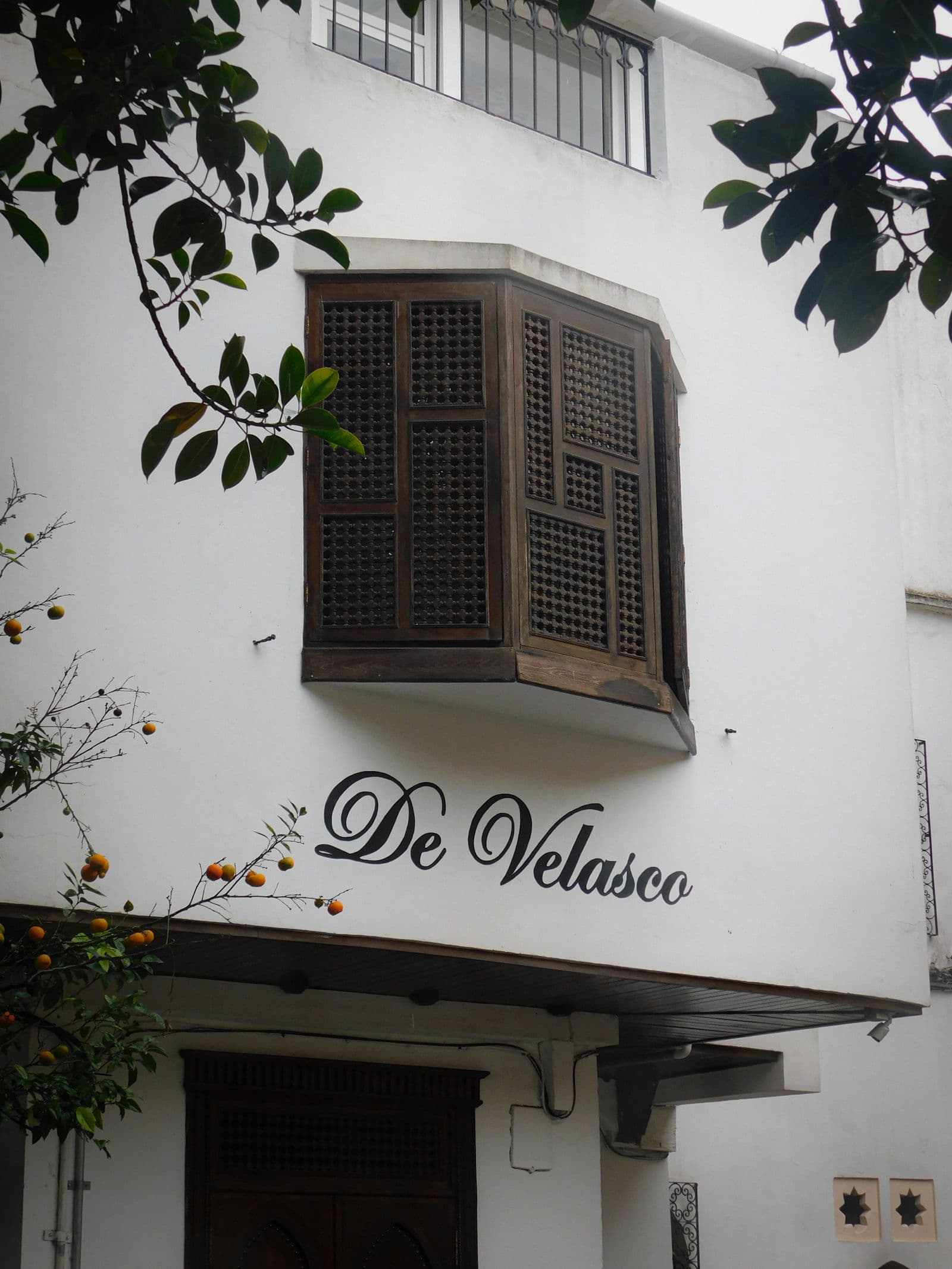 A traditional bay window with a sign in Valencia